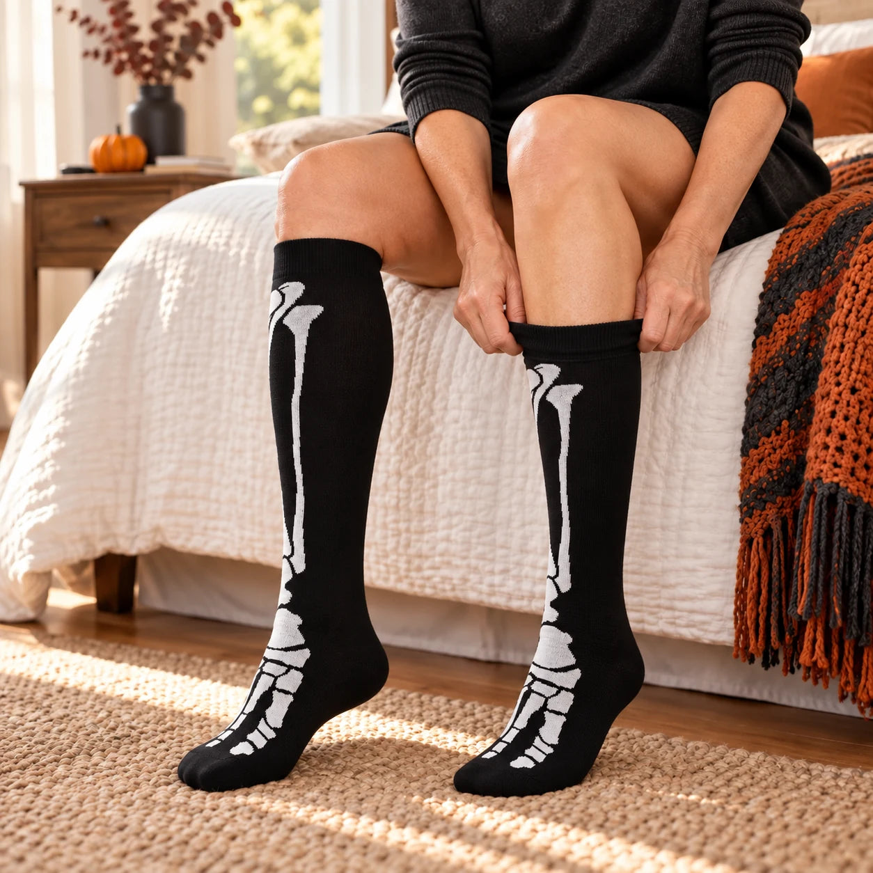 Woman applying a full-skeleton knee-high sock