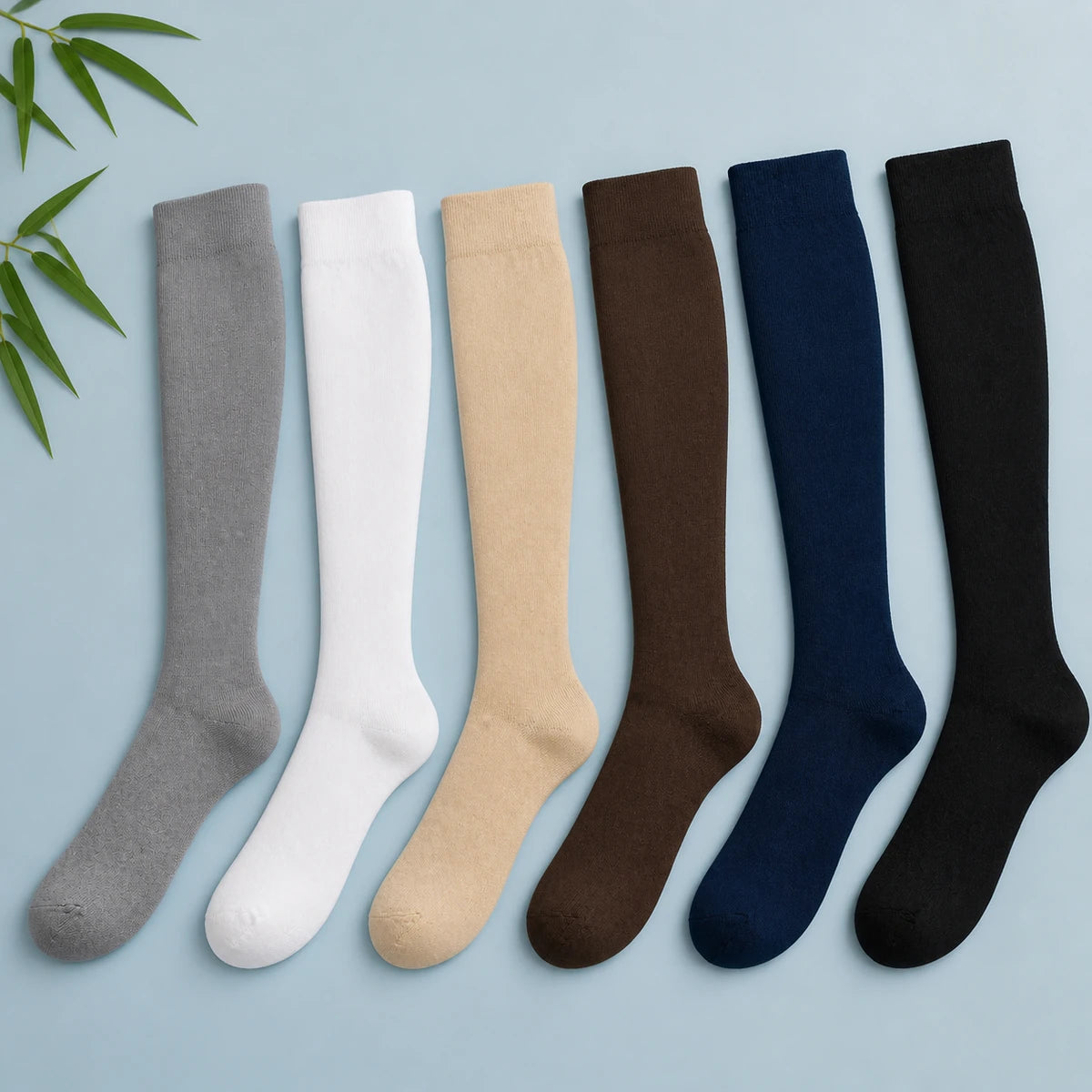 Six solid knee-high closed-toe compression socks in gray, white, beige, brown, blue, and black