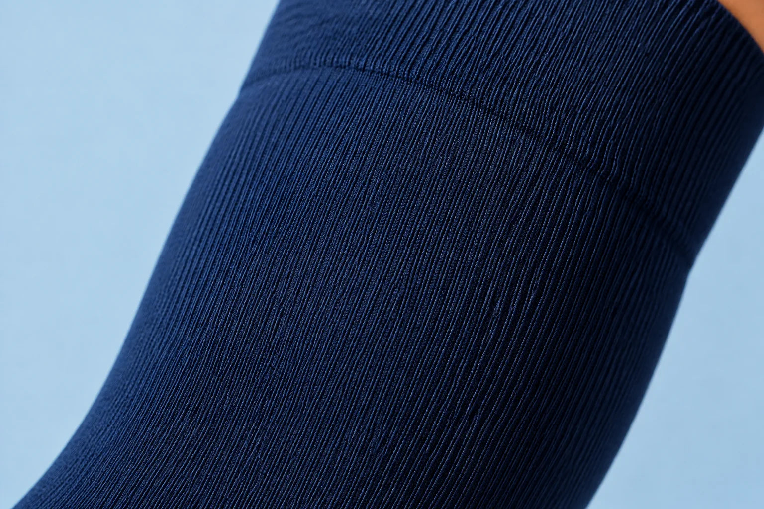 Macro view of smooth navy compression sock knit